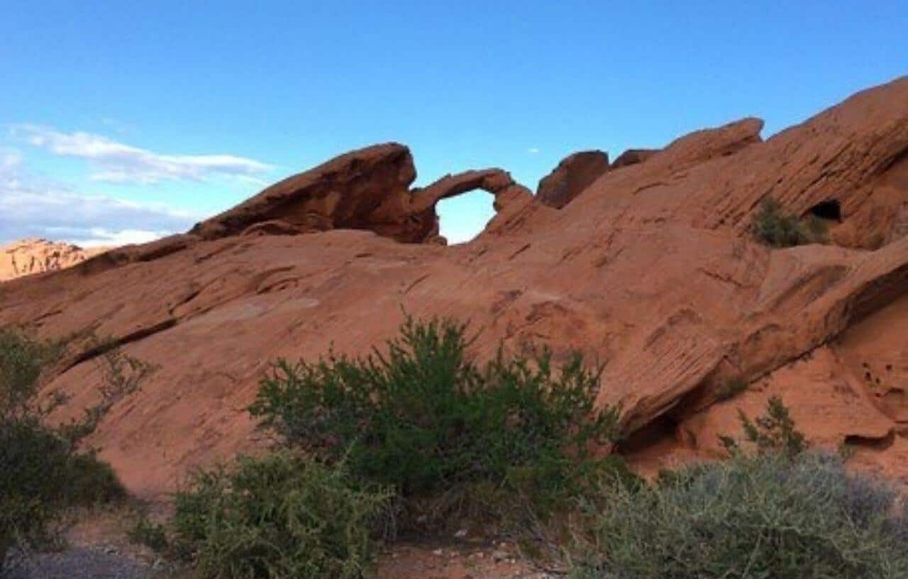 Giant rock formation with open hole called Arch Rock in Valley of Fire State Park