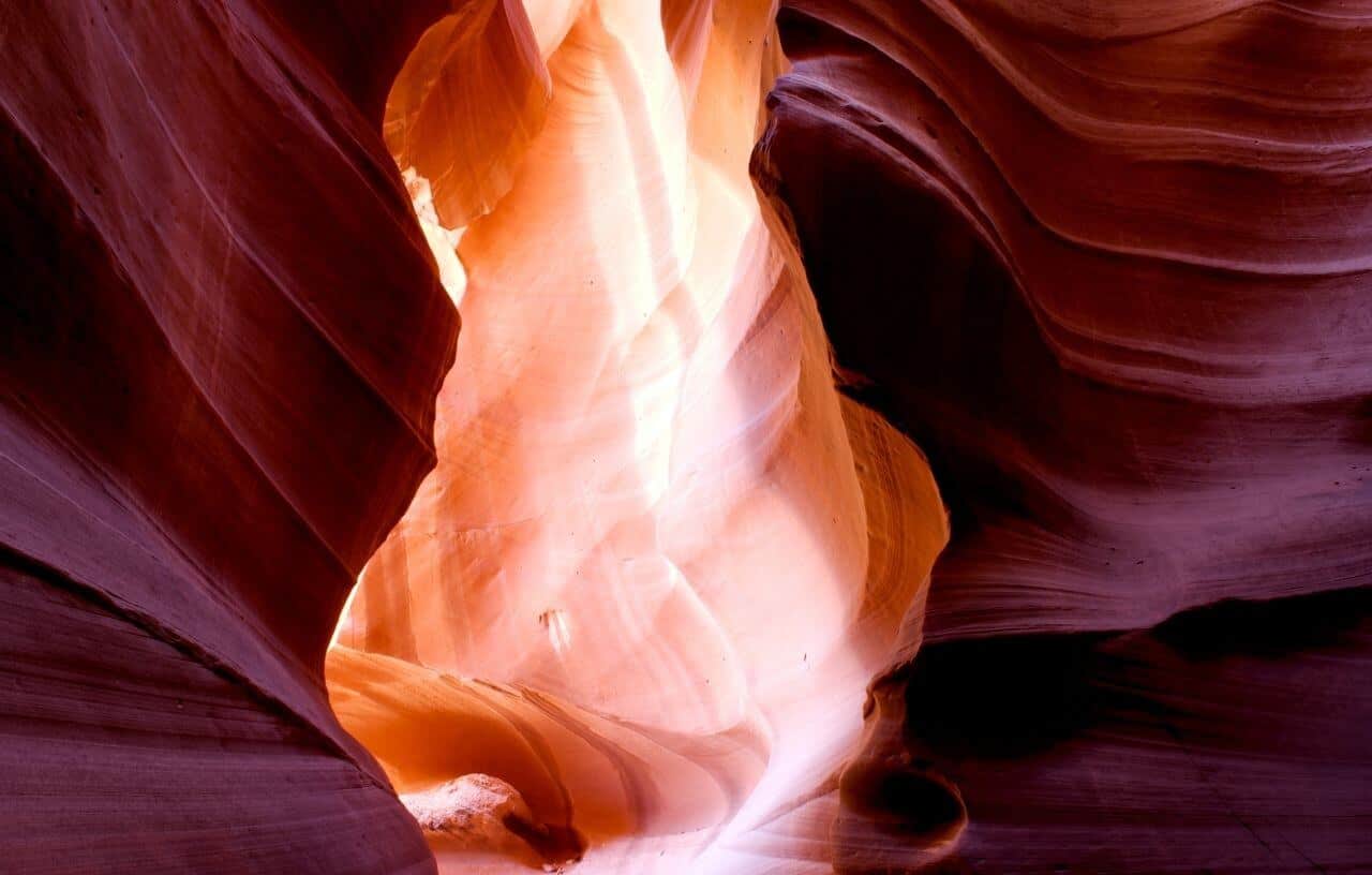 Lighting reflecting off red hued slot canyons in Upper Canyon in Antelope Canyon Paige Arizona