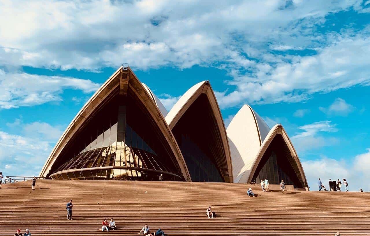 Sitting on the steps at the Opera House in Sydney